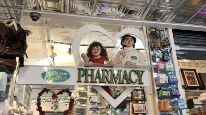 sculptures of Gary and Jolie hang from the ceiling in soho nyc store