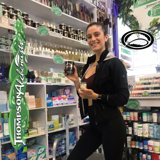 a model visiting thompson alchemists holding a sweet and downtown candle