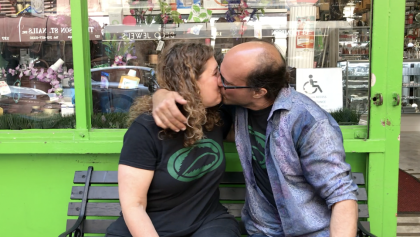 Gary the Medicine Man and Jolie, mama j showing each other love in front of their soho nyc store. 