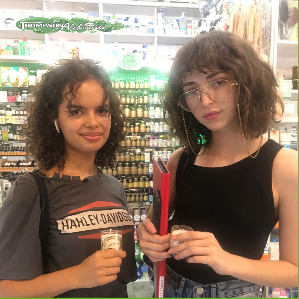 models at soho nyc thompson chemists holding thompson alchemists candles. 