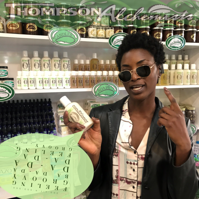 a beautiful girl with sunglasses on at Thompson Alchemists in Soho holding Thompson Alchemists Hair Conditioner